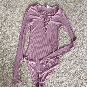 Pink body suit